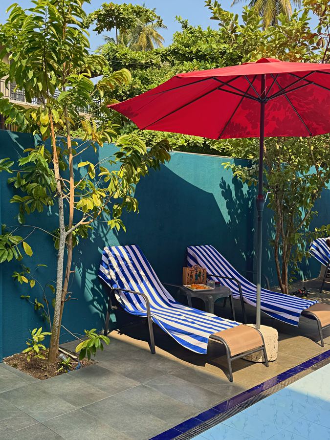 Sun loungers under the red umbrellas
