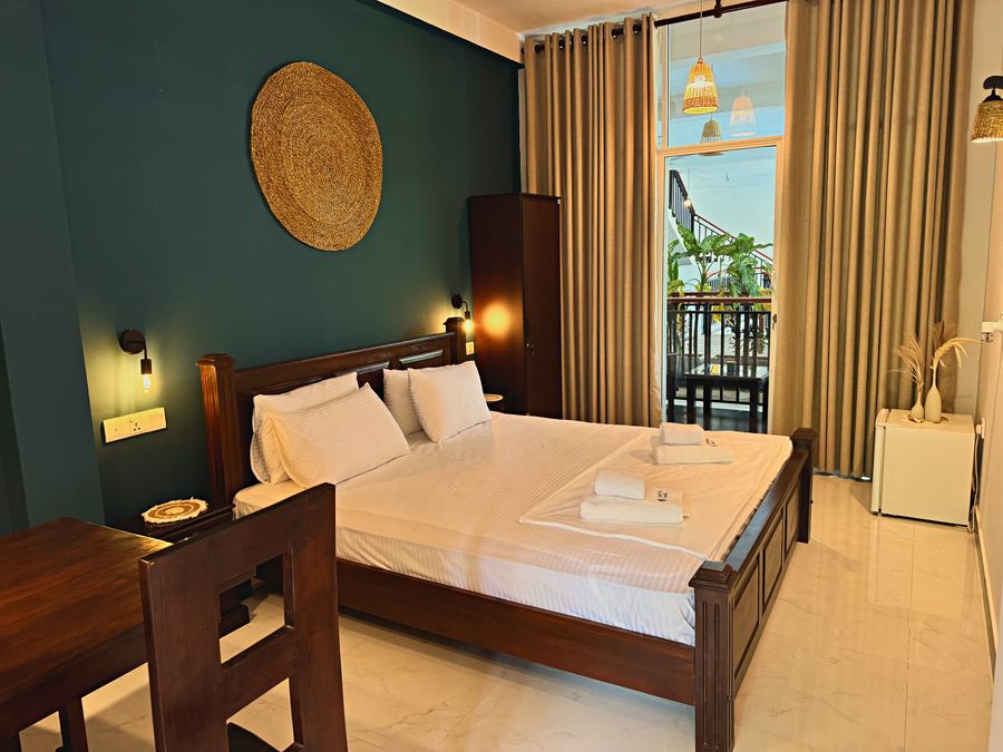 Standard Double at Santino Boutique — king bed and balcony